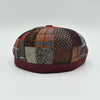 Back view of the Bordo Chianti Patchwork Newsboy Hat with unique multicolor fabric panels