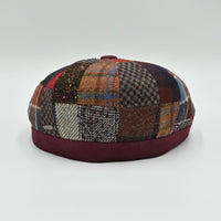 Back view of the Bordo Chianti Patchwork Newsboy Hat with unique multicolor fabric panels