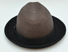 Back view of 1930's Style Two Tone Hat. Brown patterned crown with metal logo and black brim 