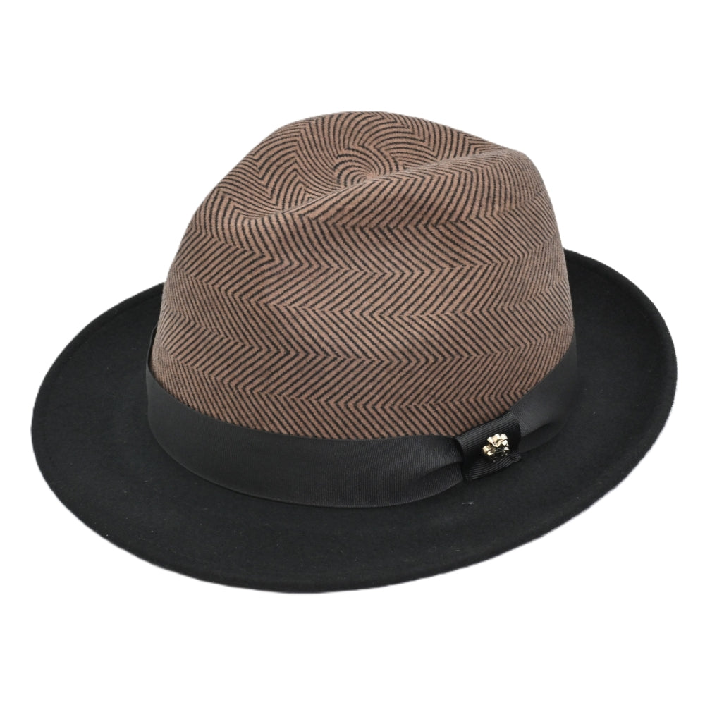 Side view of 1930's Style Two Tone Hat. Brown patterned crown with metal logo and black brim with white background