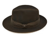 side view of 1930's style brown wool hat with metal logo on white background