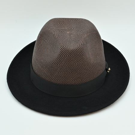 Front view of 1930's Style Two Tone Hat. Brown patterned crown with metal logo and black brim 