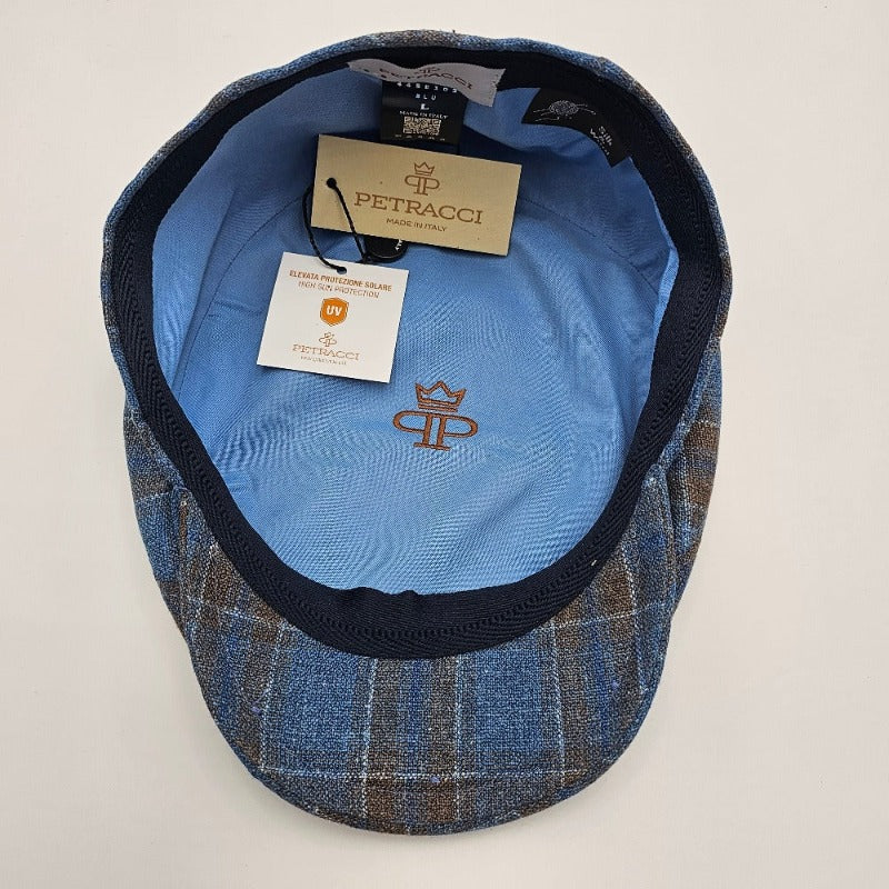 Inside view of black and blue Silk Cap with blue lining and manufacturer tags