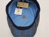 Inside view of black and blue Silk Cap with blue lining and manufacturer tags