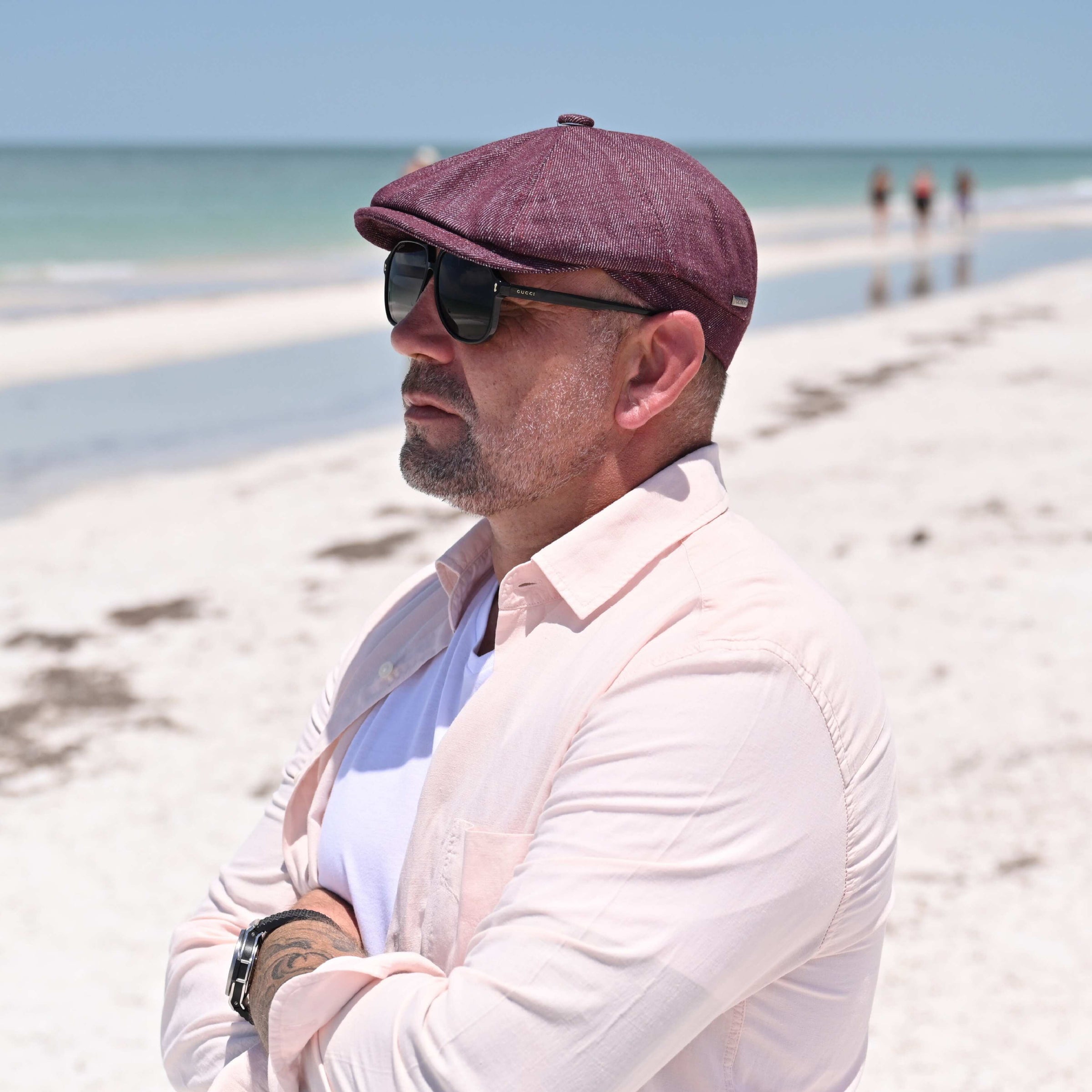man in bordo Alba Classic Newsboy Hat on the beach