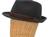 Side view of a grey alpine hat displayed on a wicker mannequin head, featuring a brown leather band with metallic accents for a sophisticated touch.