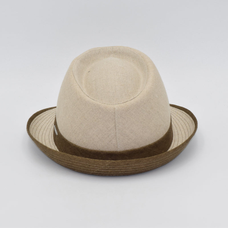 Rear view of a beige alpine hat with a structured crown, featuring a brown band and matching trim along the brim, showcasing its refined craftsmanship