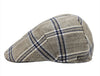 A beige flat cap with a classic blue plaid pattern, showcasing a side profile view and a subtle metallic logo accent on the side.