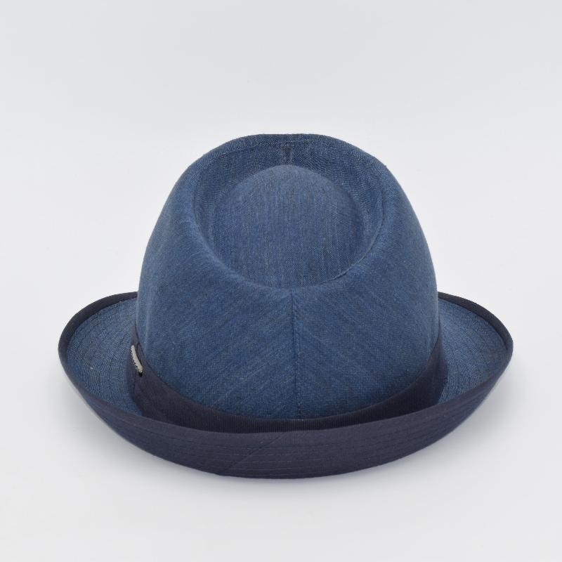 Rear view of a blue alpine hat with a structured crown, featuring a navy band and matching trim along the brim, showcasing its refined craftsmanship