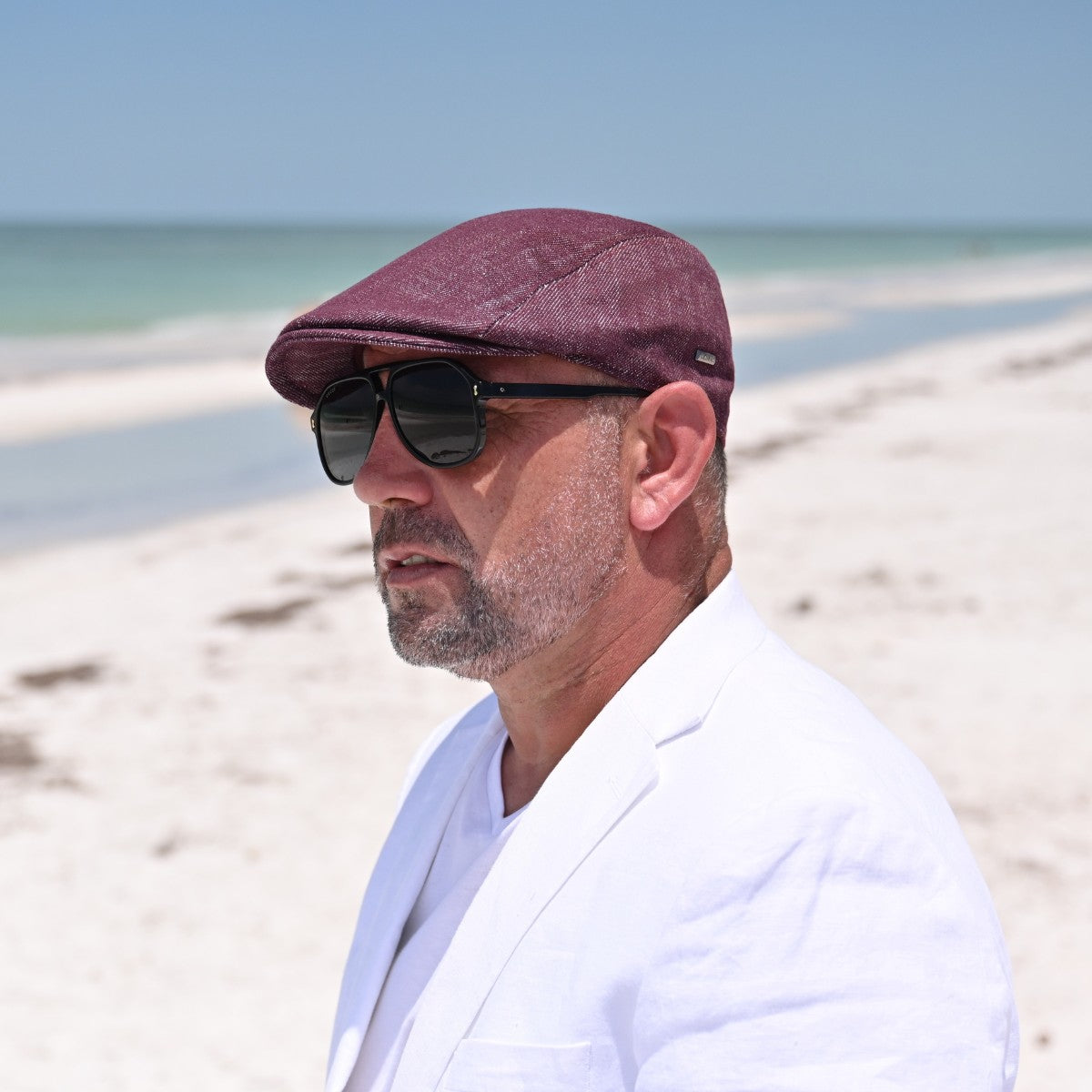 man in Bordo Alba Classic Summer Cap on the beach