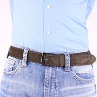 Brown suede belt with detailed stitching, worn with light-wash denim jeans and a light blue button-down shirt, showcasing a polished silver buckle.