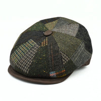 Brown Volterra Newsboy Patchwork Hat on white background. Cappello hat