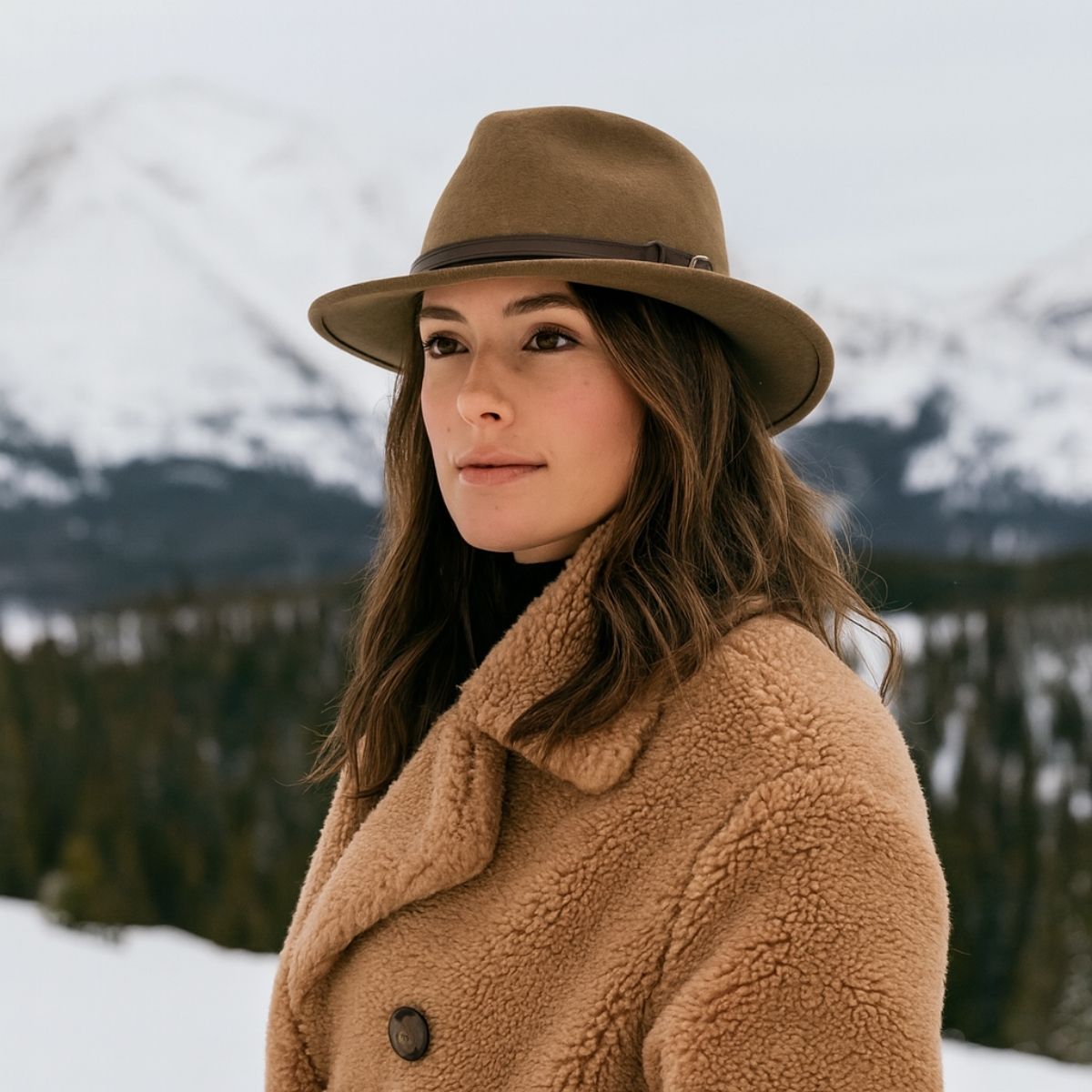 Woman wearing Caramel Indiana Jones Fedora Crushable Hat with mountains in background