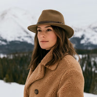 Woman in Caramel Indiana Jones Fedora Crushable Hat with mountains in background
