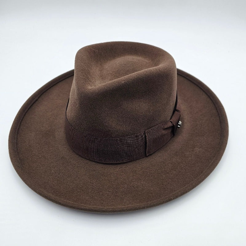 A classic brown felt fedora with a wide brim and a matching ribbon band featuring a subtle bow detail, displayed on a plain background.