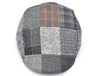 Top-down view of a grey patchwork flat cap showcasing a variety of textured plaid and checkered patterns in neutral tones with hints of red, blue, and brown accents, forming a cohesive and stylish design.