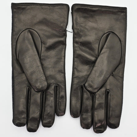 Back view of a pair of black gloves made from smooth leather, showcasing a sleek and minimalist design with a soft finish.