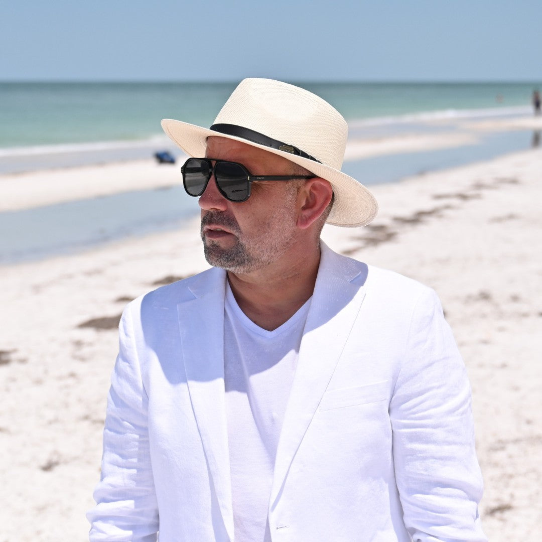 Cappello Fashion Ivory Panama Hat Indiana Style With Leather Strap on model with ocean in background