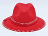 A bright red felt fedora hat with white decorative stitching along the brim and crown, featuring a red ribbon band with a small metallic button detail