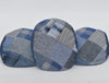 A set of three denim patchwork caps displayed side by side, showcasing their unique blend of blue fabrics with varying patterns, including plaid, herringbone, and solid weaves. Each cap highlights individual craftsmanship with a cohesive design theme, emphasizing style and versatility. Perfect for a modern yet classic look.