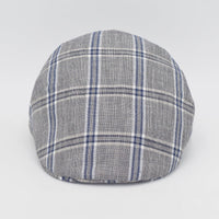 A gray flat cap with a blue and white plaid pattern, viewed from the front, highlighting its timeless and classic style.