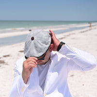 MAN IN Gray Vicenza Newsboy Hat on the beach