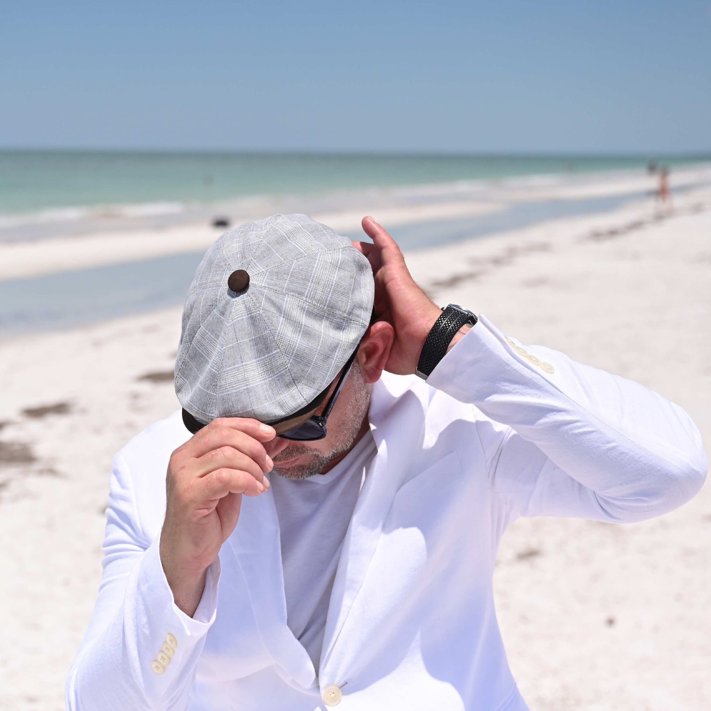 MAN IN Gray Vicenza Newsboy Hat on the beach