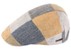 A colorful linen patchwork flat cap featuring panels in shades of blue, yellow, beige, and gray, with a subtle metallic logo accent on the side.