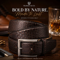 OLIMACI & CO. Brown Python Belt on the table with glass of whiskey in background
