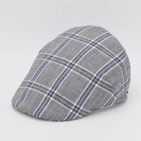 A gray flat cap with a blue and white plaid pattern, displayed at a side angle to showcase its curved design and detailed craftsmanship.