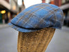 black and blue Silk Cup on mannequin with blurred buildings in the background 