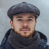 Male in Multicolor Torino Peaky Hat in the winter