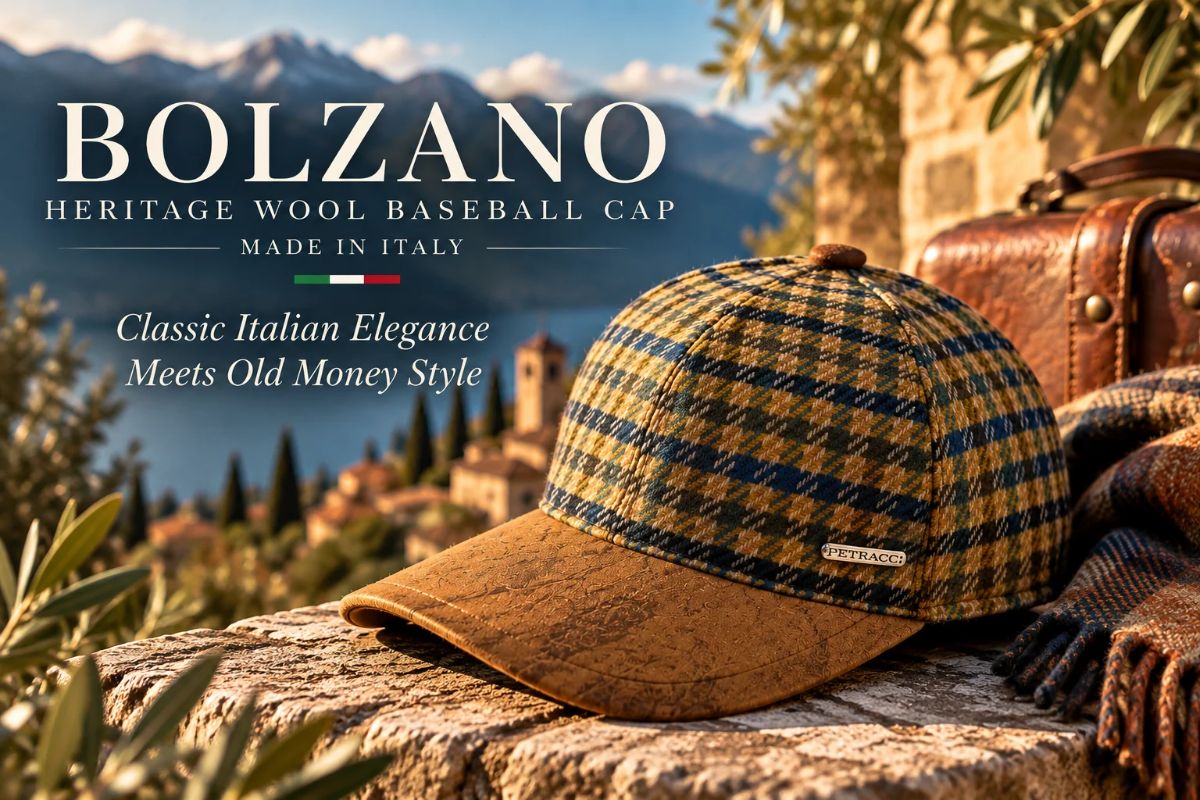 Bolzano Heritage 100% Wool Baseball Cap Made in Italy, featuring a brown faux-leather visor and classic plaid pattern, displayed against a scenic Italian countryside backdrop.