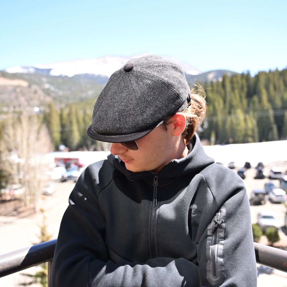 Model in charcoal Norcia Shetland Wool Leather-Trim Newsboy hat handmade in Italy – front view showing leather visor.”