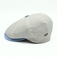 Ivory Salerno Linen Newsboy Hat with blue visor and button on white background