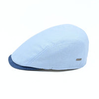 Blue Positano Linen Flat Cap on white background.  Italian summer flat cap. Olimaci.