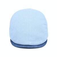 Blue Positano Linen Flat Cap on white background.  Italian summer flat cap. Olimaci.