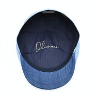 Blue Positano Linen Flat Cap on white background.  Italian summer flat cap. Olimaci.