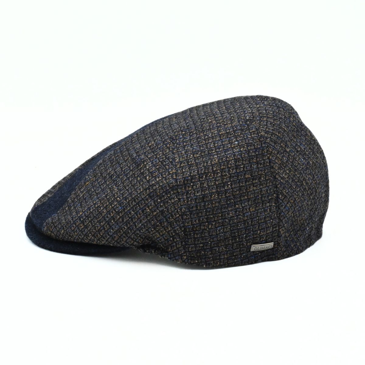 Side view of the Bergamo Cap showing navy and tweed patchwork wool panels
