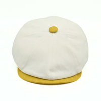 Ivory/Yellow Salerno Linen Newsboy Hat with yellow visor and button on white background