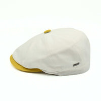Ivory/Yellow Salerno Linen Newsboy Hat with yellow visor and button on white background
