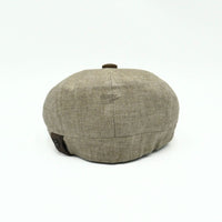 Light Brown Italian Linen Newsboy Hat with brown leather accents on a white background