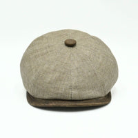 Light Brown Italian Linen Newsboy Hat with brown leather accents on a white background