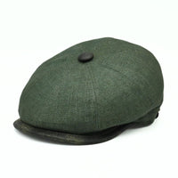 Green Italian Linen Newsboy Hat with leather accents on a white background