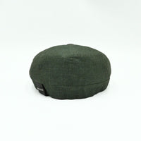 Green Italian Linen Newsboy Hat with leather accents on a white background