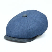 Blue Italian Linen Newsboy Hat with leather accents on a white background