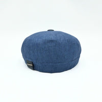 Blue Italian Linen Newsboy Hat with leather accents on a white background