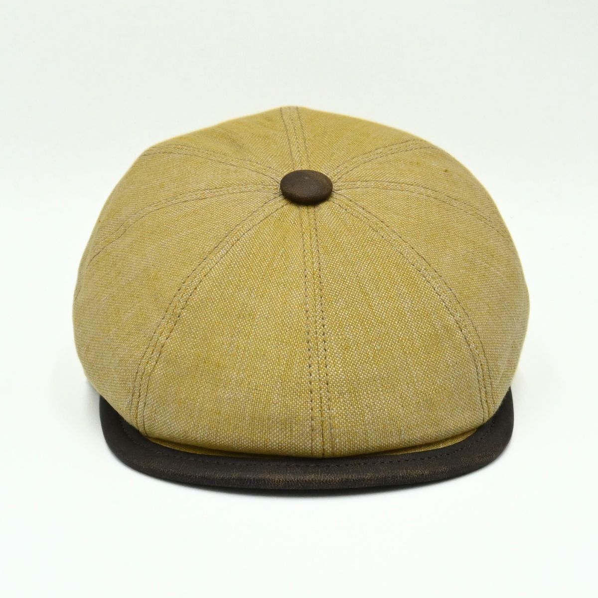 mustard Italian Linen Newsboy Hat with leather accents on a white background