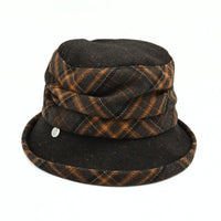 A dark brown Vittoria Women's Wool Cloche Hat – Plaid Accents with a matching fabric band and a small silver metal emblem on the front of the brim, shown against a plain white background.