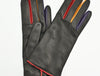 Elegant leather gloves crafted with a smooth black finish, featuring vibrant contrasting colors between the fingers and along the trim, offering a unique blend of sophistication and bold design.